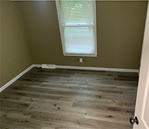 subfloor with swelling and water stains