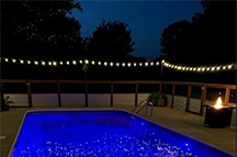 Completed fence around pool with ambient light